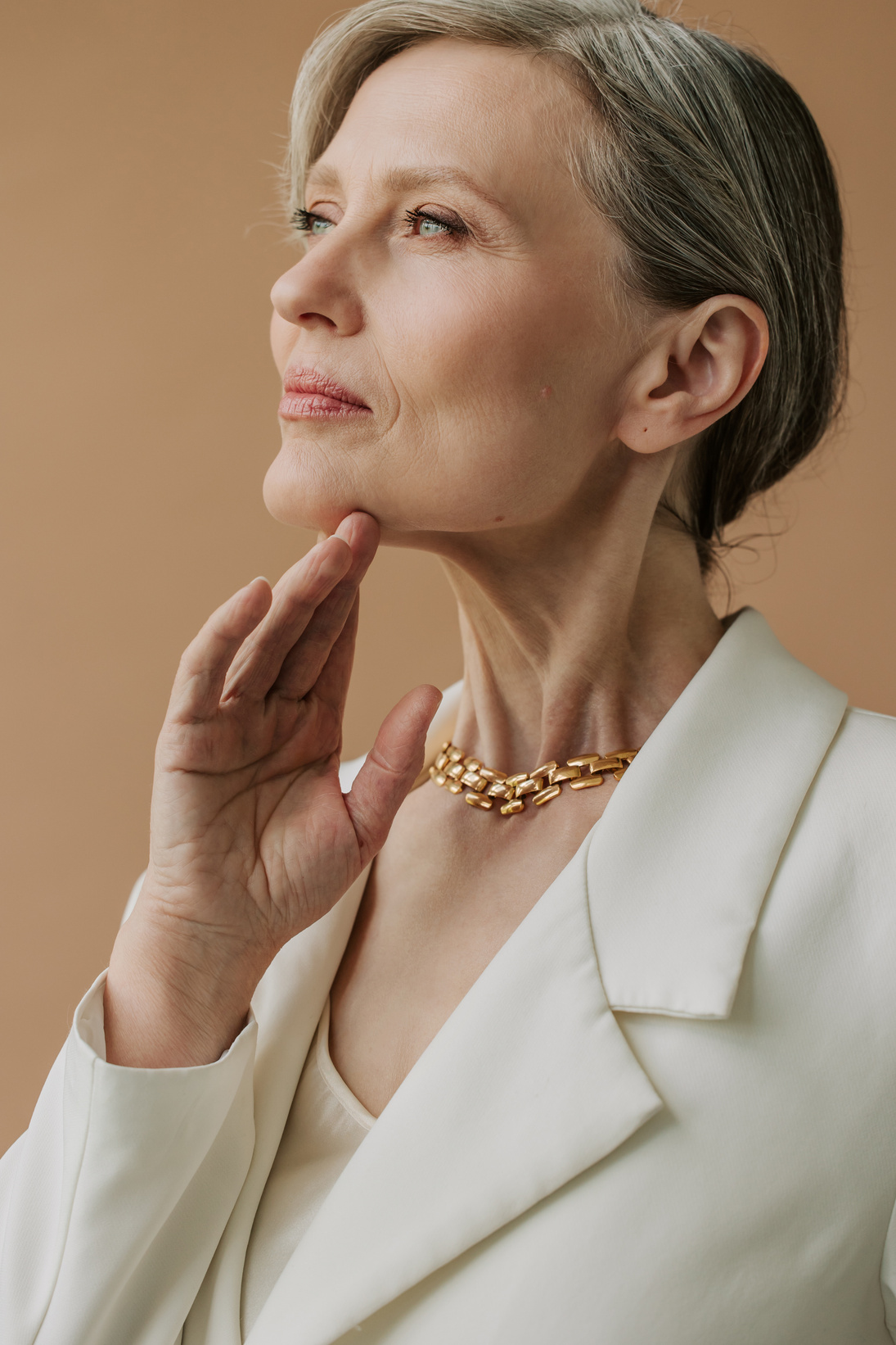 Portrait of a Senior Woman in Gold Necklace